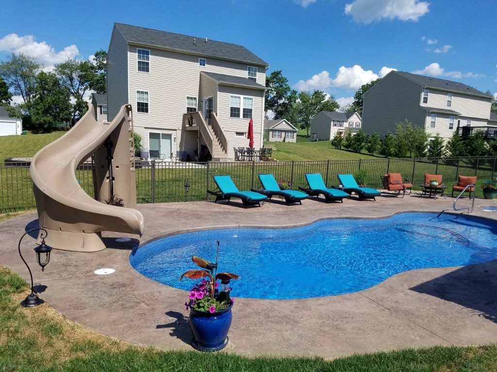 Pool picture with slide and house